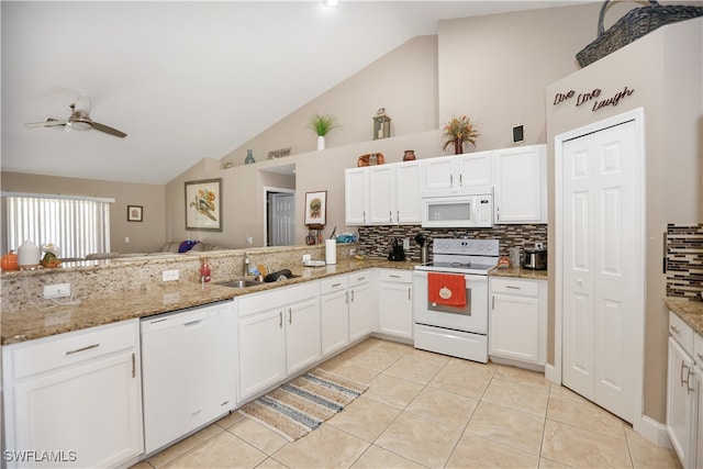 kitchen featuring kitchen peninsula, white cabinetry, light stone countertops, light tile patterned flooring, and white appliances