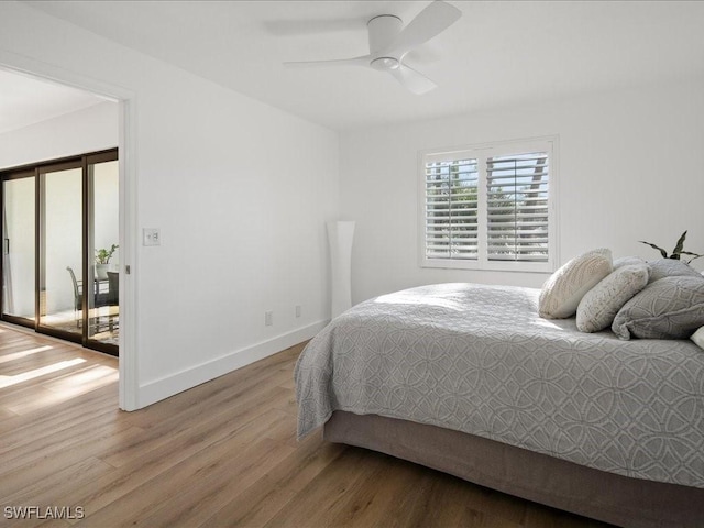 bedroom with ceiling fan and hardwood / wood-style floors