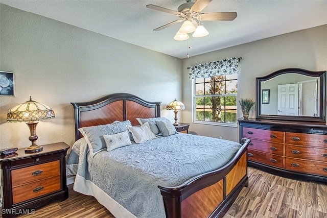 bedroom featuring hardwood / wood-style floors and ceiling fan