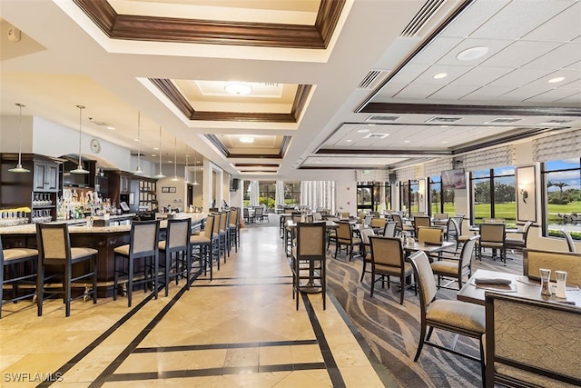 dining room featuring coffered ceiling and ornamental molding