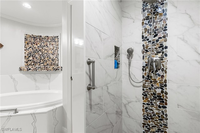 bathroom with a washtub and ornamental molding