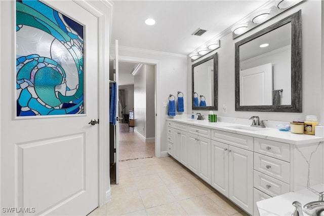 bathroom with tile patterned flooring, vanity, and ornamental molding