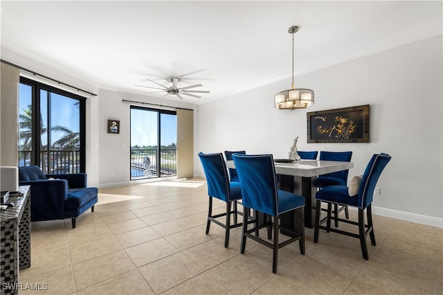 dining space with crown molding, light tile patterned floors, and ceiling fan with notable chandelier