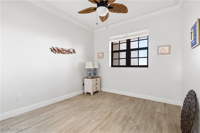 unfurnished room with ceiling fan, light wood-type flooring, and crown molding