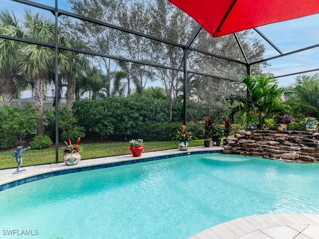 view of pool with a lanai