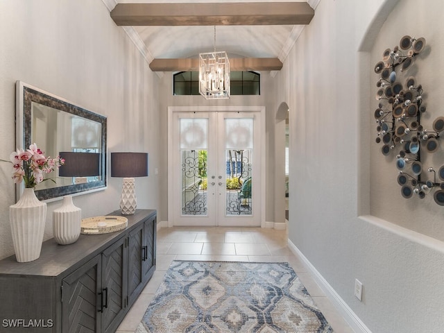 foyer featuring beamed ceiling, light tile patterned floors, an inviting chandelier, and french doors