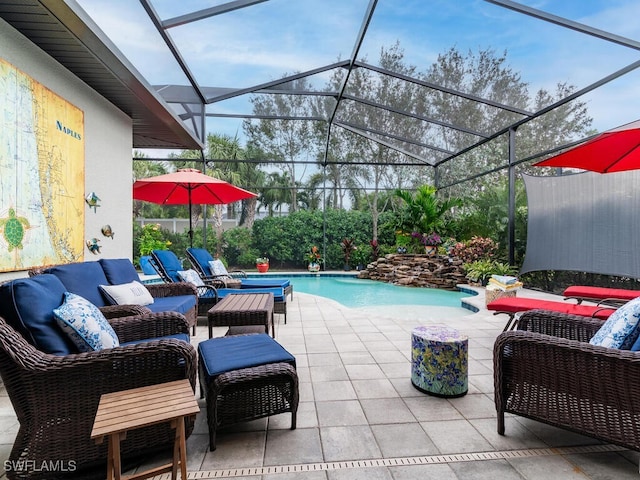 view of patio / terrace featuring glass enclosure and outdoor lounge area