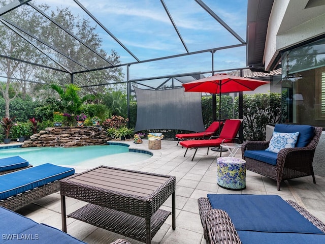 view of patio featuring a lanai