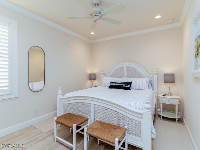 bedroom featuring ornamental molding, hardwood / wood-style floors, and ceiling fan