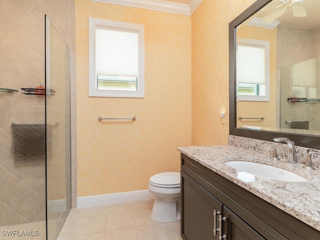 bathroom with tile patterned floors, vanity, toilet, and ornamental molding