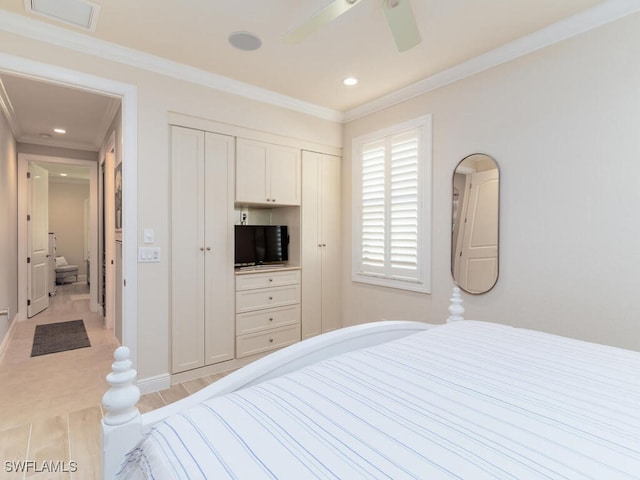 bedroom featuring ceiling fan, a closet, and ornamental molding