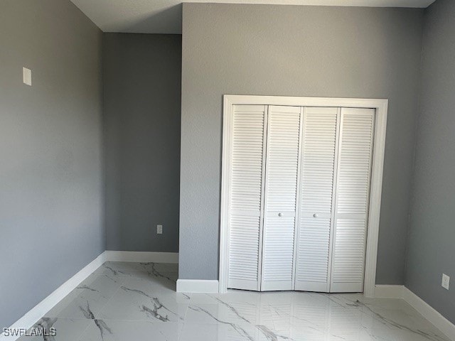 unfurnished bedroom with a closet