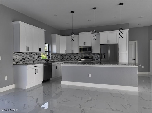 kitchen with white cabinetry, marble finish floor, a center island, black appliances, and decorative light fixtures