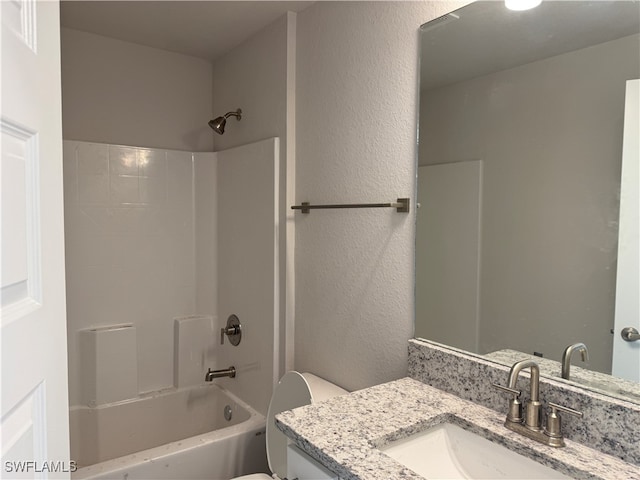 full bathroom featuring toilet, vanity, and bathing tub / shower combination