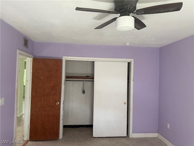 unfurnished bedroom featuring a closet and ceiling fan