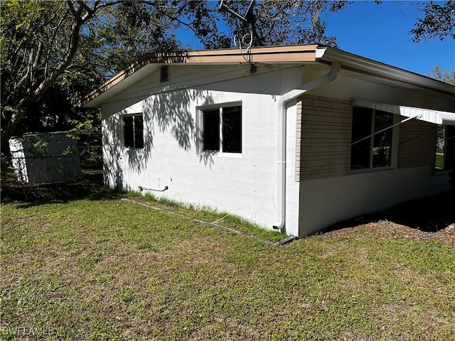 view of home's exterior featuring a lawn