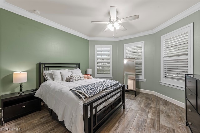 bedroom featuring ceiling fan, crown molding, and dark hardwood / wood-style flooring