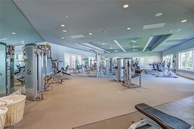 gym featuring ceiling fan and light carpet