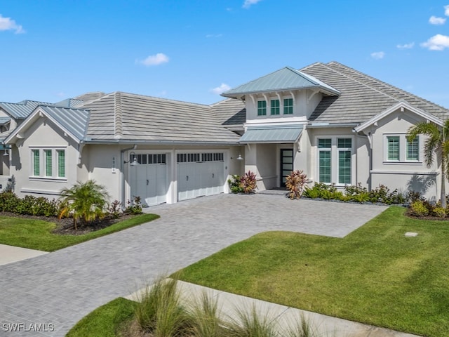 view of front facade featuring a front yard and a garage