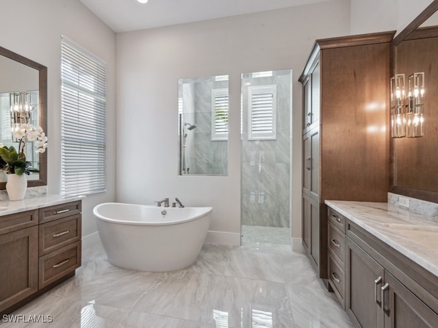 bathroom featuring vanity, shower with separate bathtub, and a healthy amount of sunlight