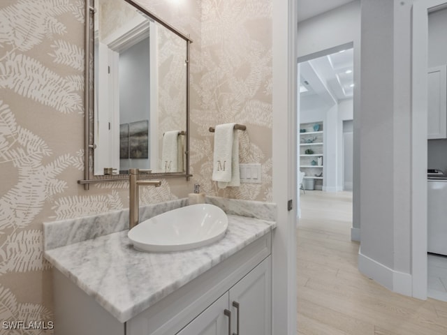 bathroom with vanity and hardwood / wood-style floors