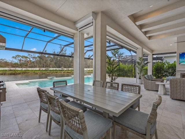 view of patio featuring a water view and glass enclosure