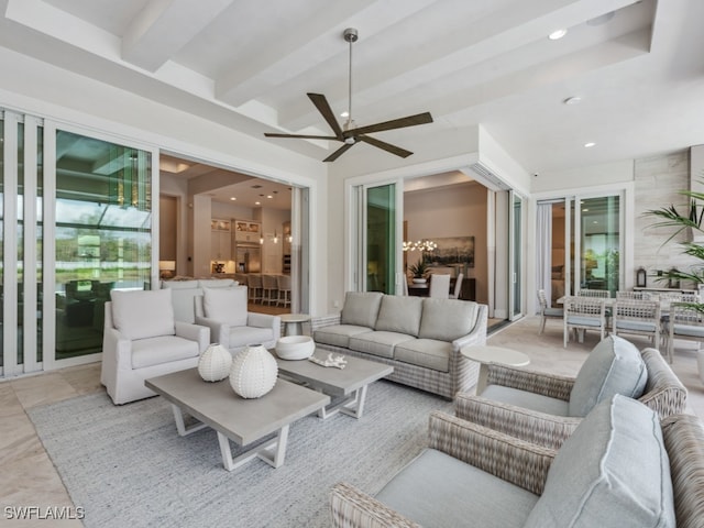 living room with beam ceiling and ceiling fan