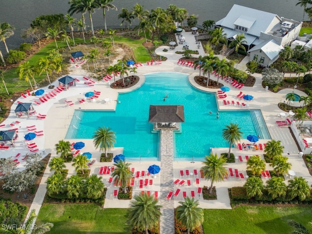 birds eye view of property with a water view