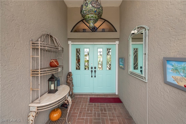 property entrance featuring french doors