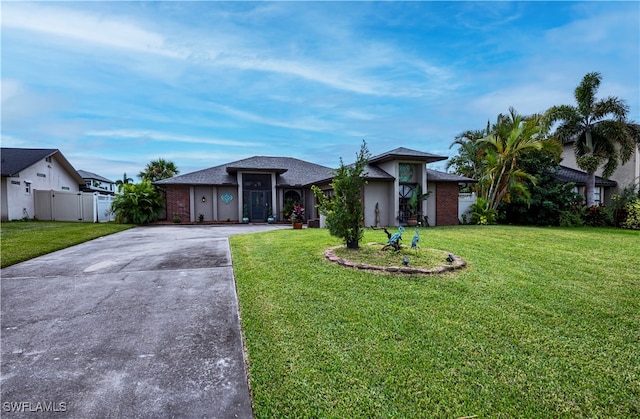 ranch-style house with a front yard