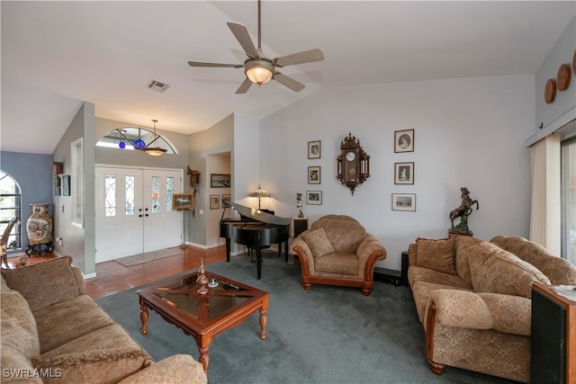 carpeted living room featuring ceiling fan and vaulted ceiling