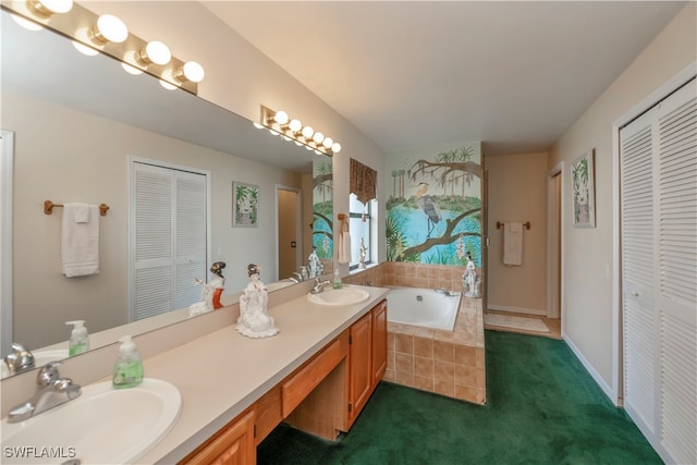 bathroom featuring vanity and tiled bath