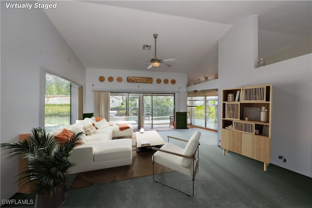 living room with carpet, ceiling fan, high vaulted ceiling, and plenty of natural light