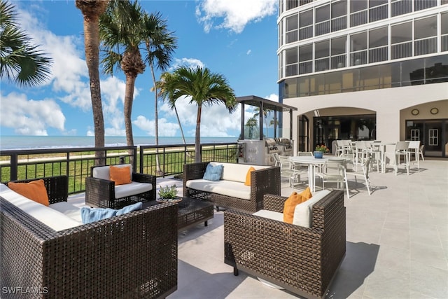 view of patio featuring an outdoor living space and a water view