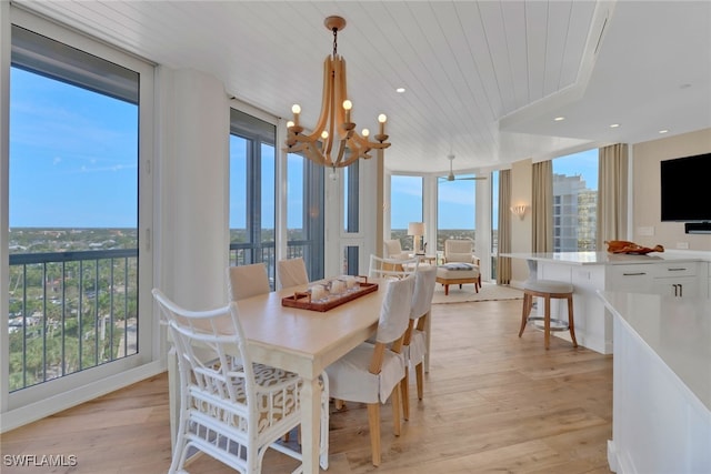 dining room with wooden ceiling, a chandelier, light wood-type flooring, and expansive windows