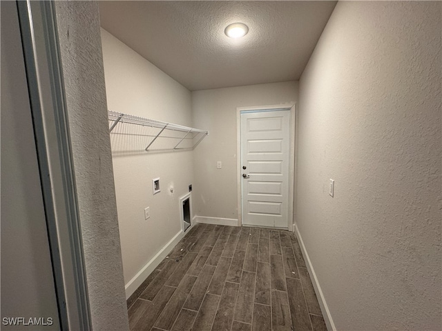 washroom featuring washer hookup, electric dryer hookup, hookup for a gas dryer, dark hardwood / wood-style floors, and a textured ceiling