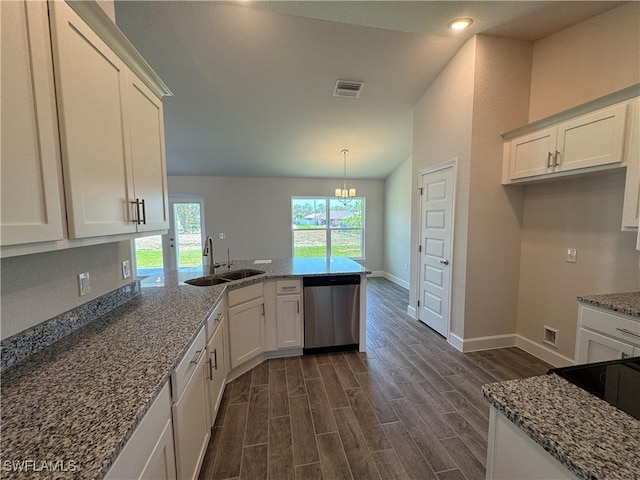 2324 Jacaranda Pkwy W, Cape Coral, FL 33993 - kitchen with a sink, dishwasher, a peninsula, stone counters, and lofted ceiling