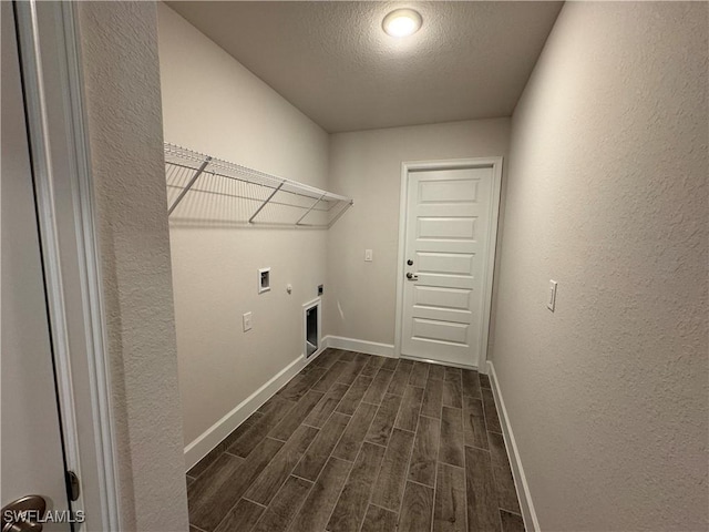 2324 Jacaranda Pkwy W, Cape Coral, FL 33993 - laundry room with hookup for an electric dryer, laundry area, dark wood finished floors, baseboards, and a textured wall
