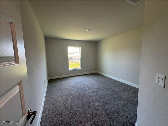 2324 Jacaranda Pkwy W, Cape Coral, FL 33993 - empty room featuring carpet flooring, baseboards, visible vents, and a textured wall