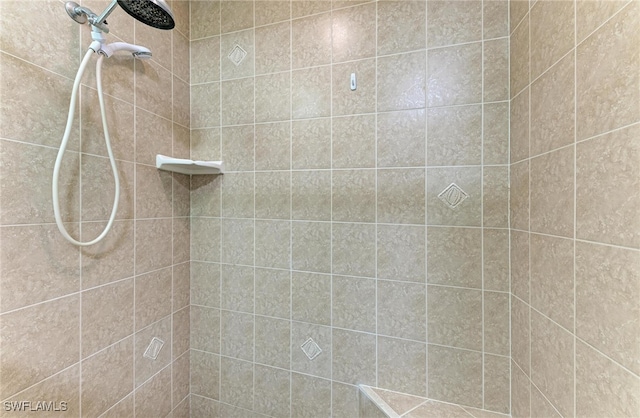 bathroom with a tile shower