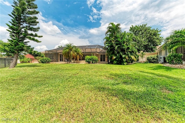 view of yard featuring a lanai