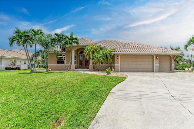 mediterranean / spanish-style house with a front lawn and a garage