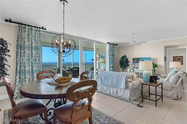 tiled dining area with ornamental molding, a water view, and ceiling fan with notable chandelier