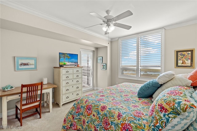 carpeted bedroom featuring ornamental molding and ceiling fan