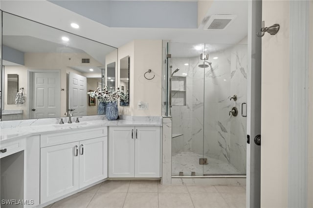 bathroom with vanity, tile patterned floors, and walk in shower