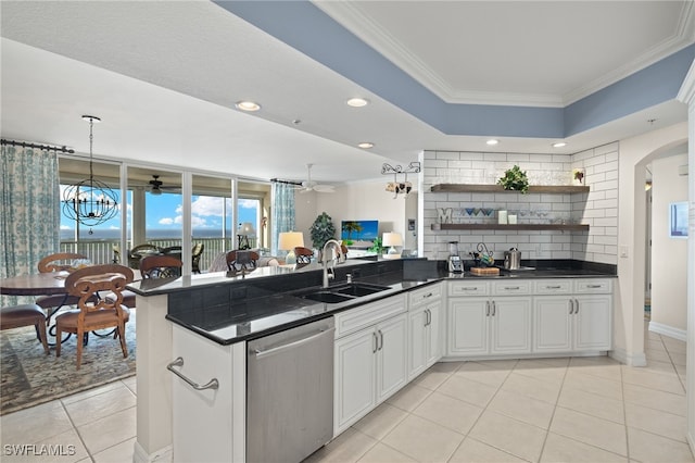 kitchen with white cabinetry, ornamental molding, sink, and stainless steel dishwasher