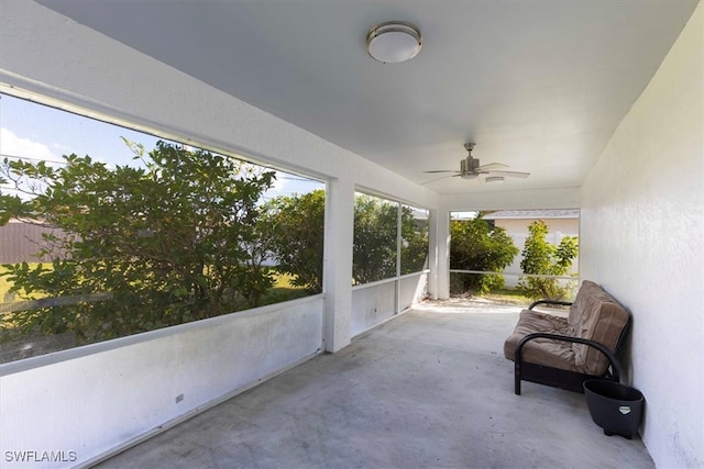 sunroom / solarium with ceiling fan