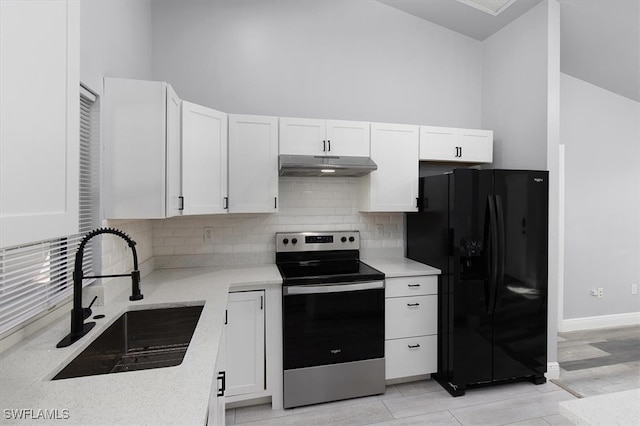 kitchen with black refrigerator with ice dispenser, stainless steel electric range, tasteful backsplash, white cabinetry, and sink