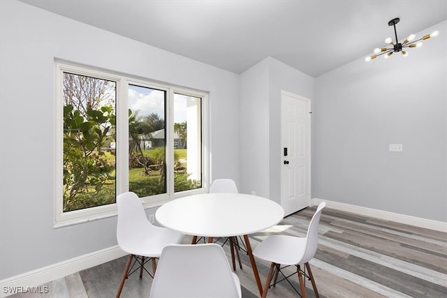 dining area featuring a chandelier and hardwood / wood-style floors