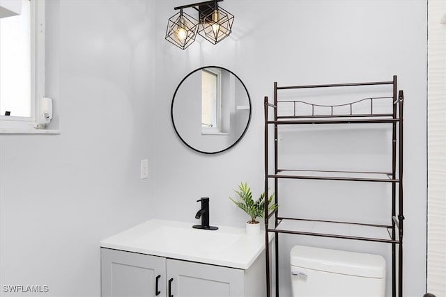 bathroom featuring toilet and vanity